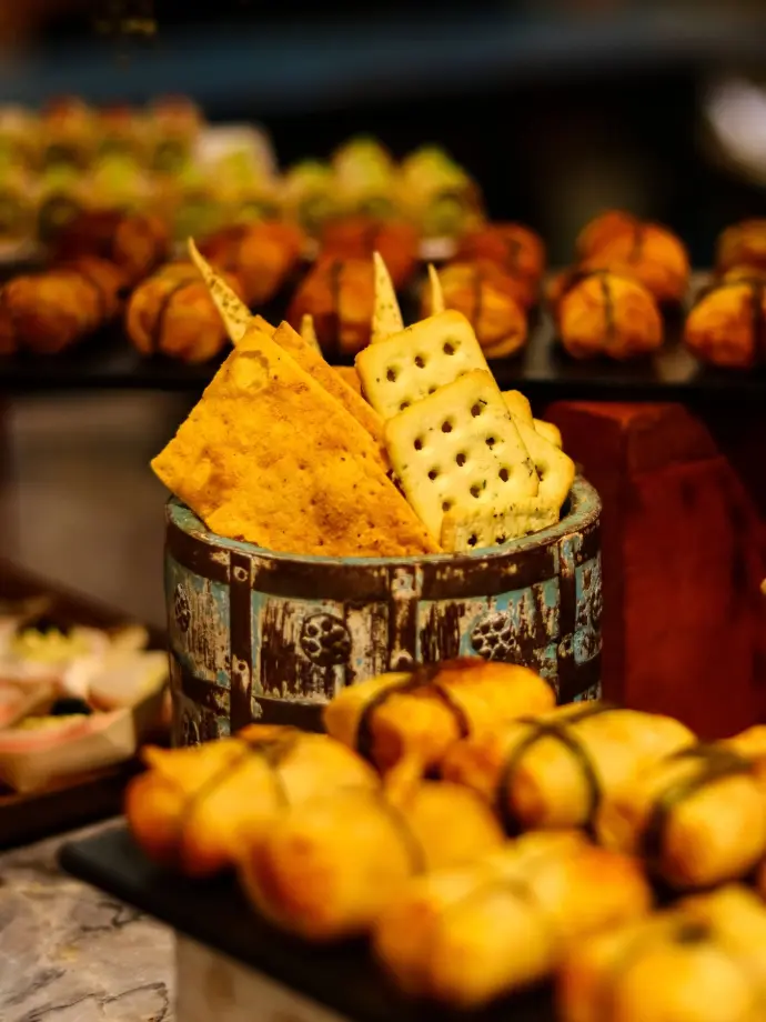 A rich, cinematic shot of gourmet crackers and snacks, showcasing vibrant textures and warm tones — perfect for capturing the art of food storytelling.